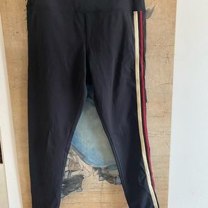 Pull on stretch leggings, black with Stripe on one leg detail